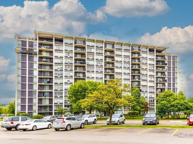 8801 W Golf Rd Unit 6J, Niles, IL 60714 - view of apartment building / complex featuring uncovered parking