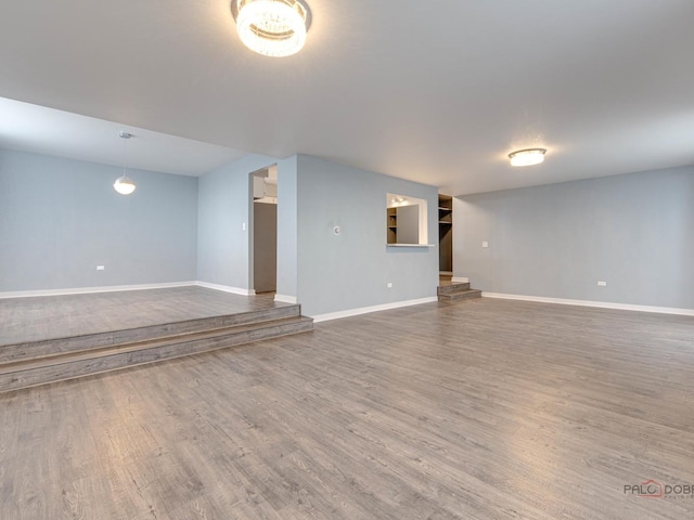 8801 W Golf Rd Unit 6J, Niles, IL 60714 - finished below grade area featuring wood finished floors and baseboards