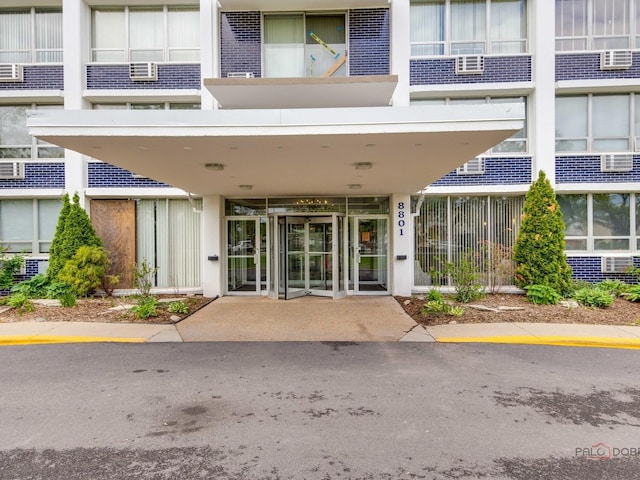 8801 W Golf Rd Unit 6J, Niles, IL 60714 - view of exterior entry with brick siding