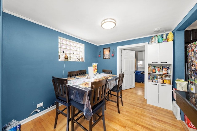 3642 S Central Ave, Cicero, IL 60804 - dining area with ornamental molding, light wood-type flooring, and baseboards