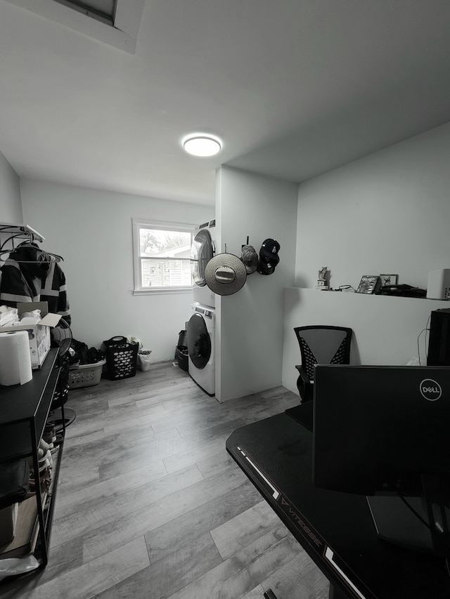 washroom with washer / clothes dryer and wood finished floors