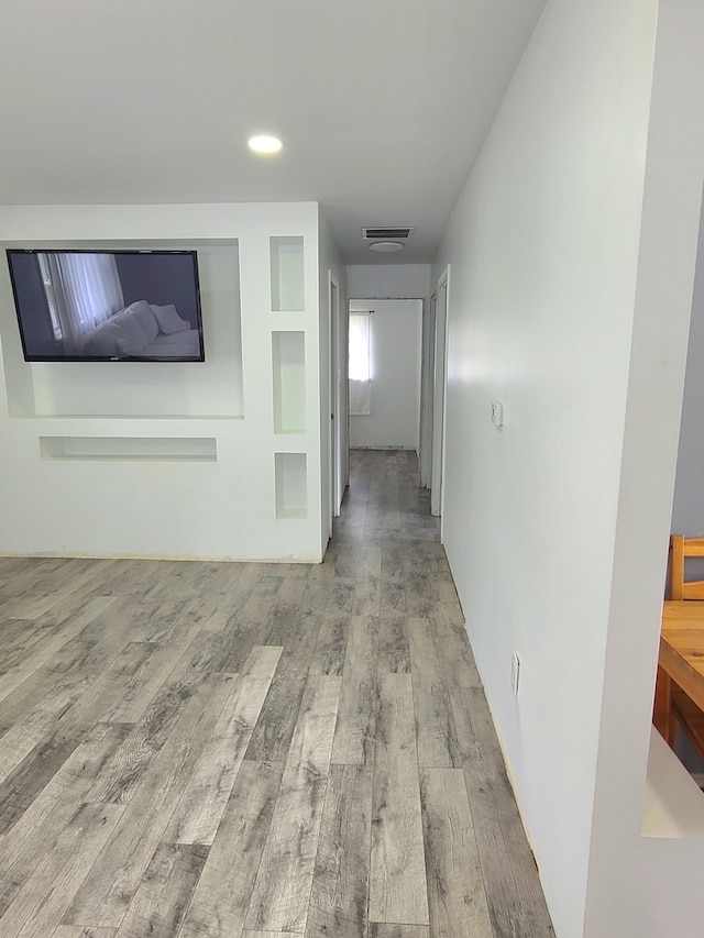 hall featuring wood finished floors