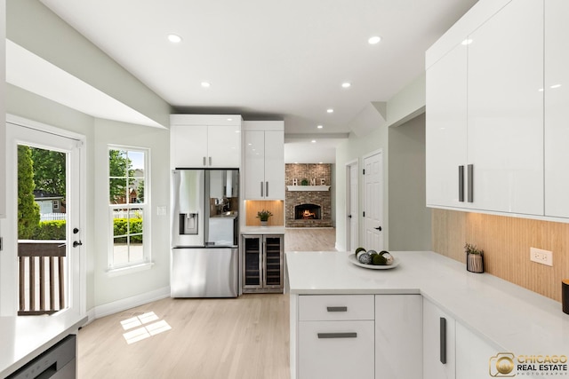 23653 W Ewing Dr, Plainfield, IL 60586 - kitchen with wine cooler, stainless steel fridge with ice dispenser, modern cabinets, tasteful backsplash, and recessed lighting