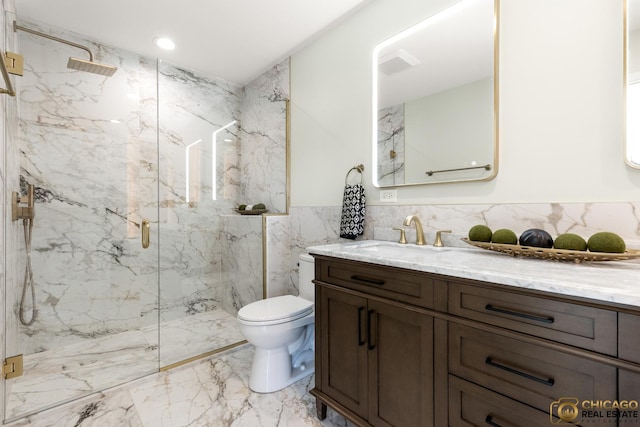 23653 W Ewing Dr, Plainfield, IL 60586 - full bathroom with marble tiled flooring, a marble finish shower, vanity, tile walls, and toilet