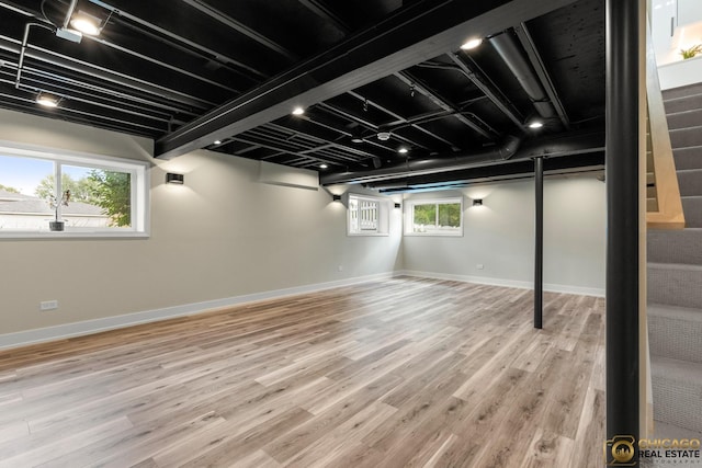 23653 W Ewing Dr, Plainfield, IL 60586 - basement with wood finished floors, baseboards, and stairway