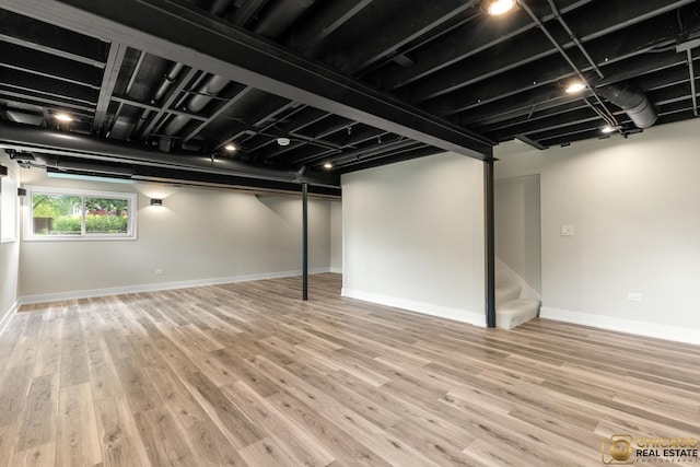 23653 W Ewing Dr, Plainfield, IL 60586 - below grade area with wood finished floors, stairs, and baseboards