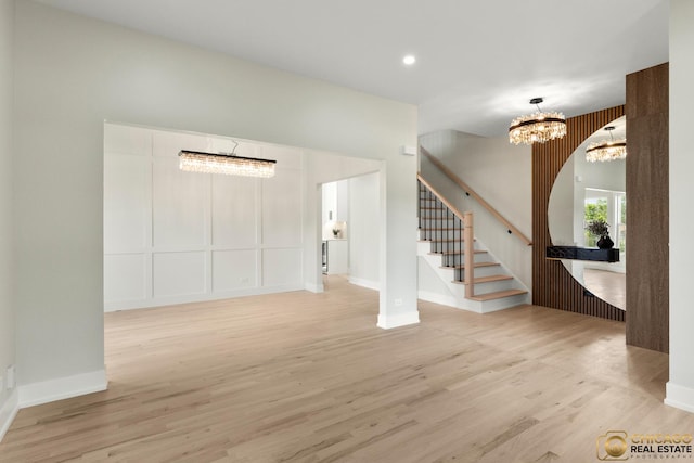 23653 W Ewing Dr, Plainfield, IL 60586 - foyer entrance with a chandelier, stairway, light wood finished floors, baseboards, and recessed lighting