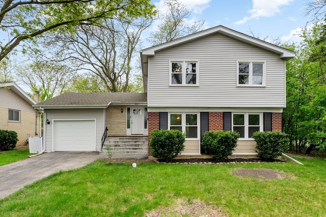 666 Barberry Rd, Highland Park, IL 60035 - tri-level home featuring a garage, driveway, a front lawn, and brick siding