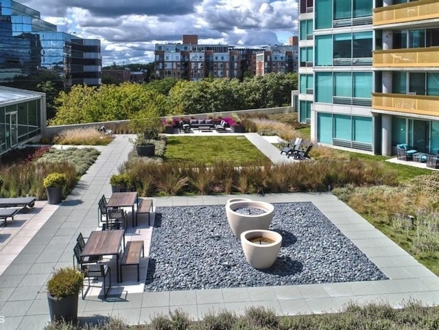 1720 Maple Ave Unit 670, Evanston, IL 60201 - view of community featuring a view of city, an outdoor fire pit, and a patio area
