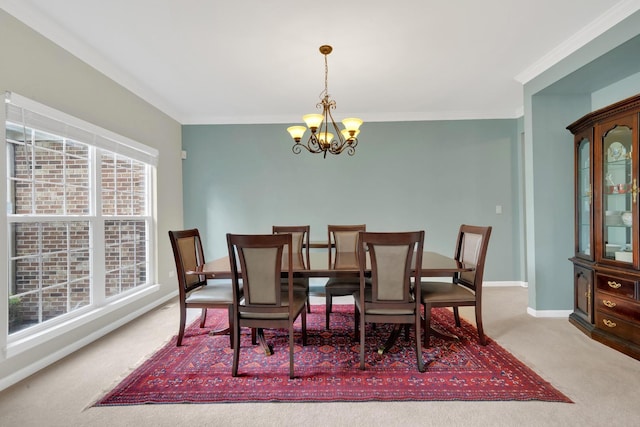 26809 Ashgate Xing, Plainfield, IL 60585 - carpeted dining area featuring a chandelier, baseboards, and crown molding