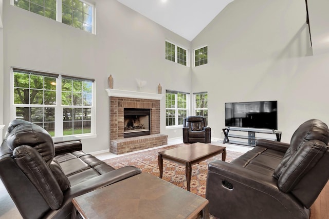 26809 Ashgate Xing, Plainfield, IL 60585 - living room featuring high vaulted ceiling, plenty of natural light, a brick fireplace, and baseboards