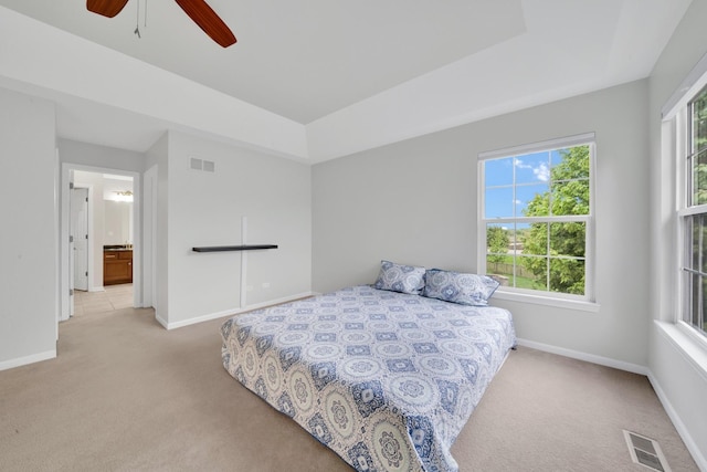 26809 Ashgate Xing, Plainfield, IL 60585 - carpeted bedroom featuring multiple windows, baseboards, and ceiling fan