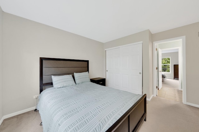 26809 Ashgate Xing, Plainfield, IL 60585 - bedroom featuring light colored carpet, baseboards, and a closet