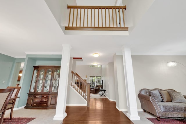 26809 Ashgate Xing, Plainfield, IL 60585 - entryway with decorative columns, stairs, baseboards, and wood finished floors