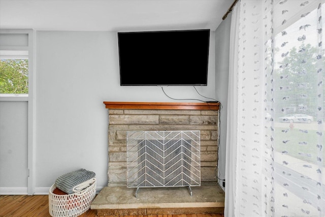 1602 Normandy Dr, Champaign, IL 61821 - detailed view of wood finished floors, baseboards, and a stone fireplace