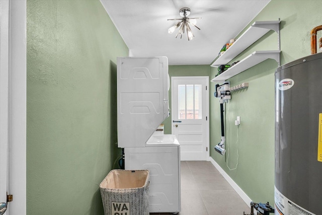 1602 Normandy Dr, Champaign, IL 61821 - laundry room featuring gas water heater, estacked washer and dryer, baseboards, a textured wall, and a chandelier