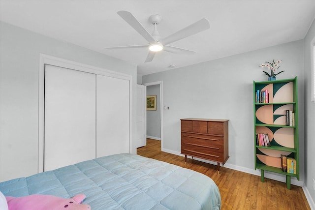 1602 Normandy Dr, Champaign, IL 61821 - bedroom with wood finished floors, a closet, baseboards, and ceiling fan