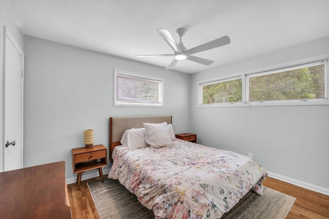 1602 Normandy Dr, Champaign, IL 61821 - bedroom with wood finished floors, baseboards, and ceiling fan