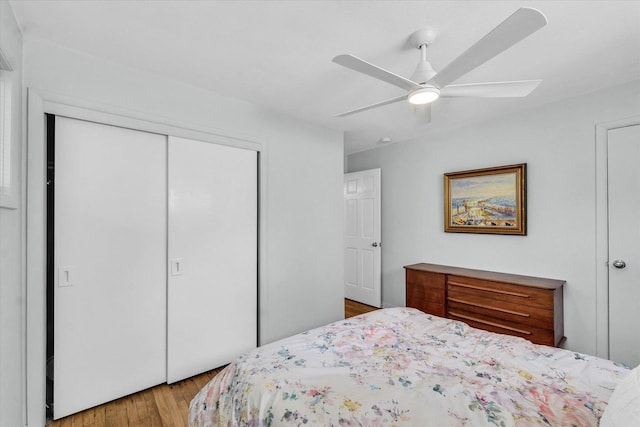 1602 Normandy Dr, Champaign, IL 61821 - bedroom with wood finished floors, a closet, and a ceiling fan