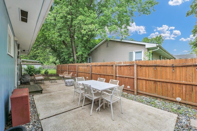 1602 Normandy Dr, Champaign, IL 61821 - fenced backyard with a patio and outdoor dining space