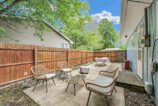 1602 Normandy Dr, Champaign, IL 61821 - fenced backyard with outdoor dining space and a patio area
