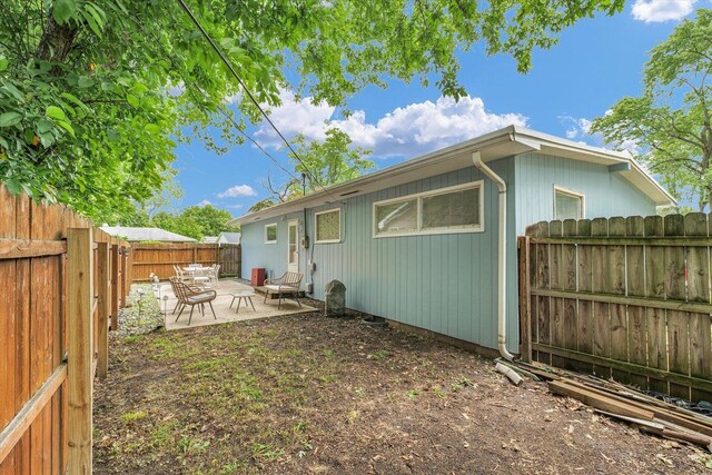 1602 Normandy Dr, Champaign, IL 61821 - rear view of property with a patio and a fenced backyard