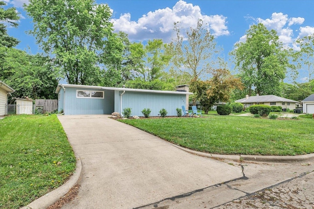 1602 Normandy Dr, Champaign, IL 61821 - mid-century home featuring concrete driveway
