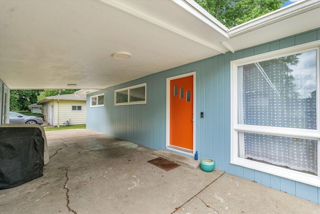 1602 Normandy Dr, Champaign, IL 61821 - property entrance featuring an attached carport