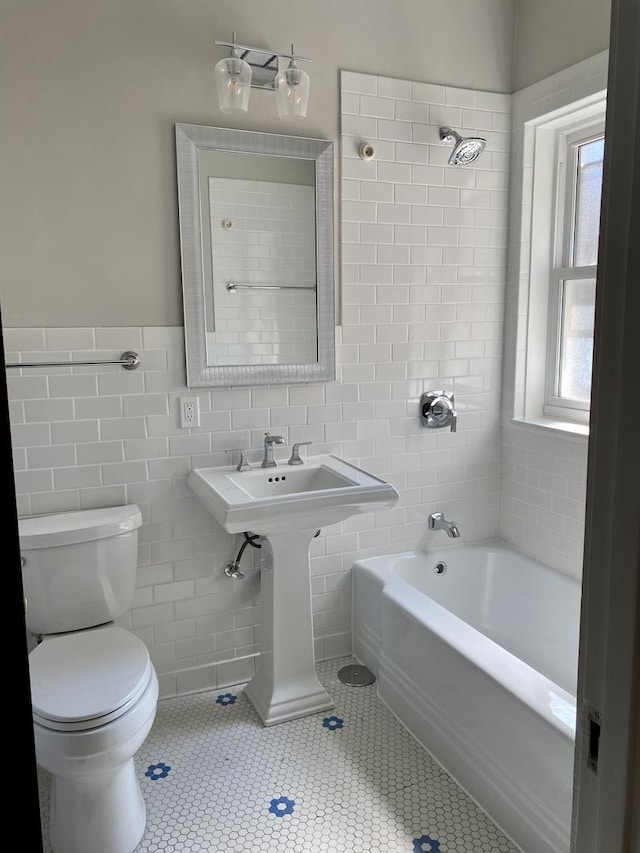 806 Forest Ave Unit 3, Evanston, IL 60202 - full bathroom with tile walls, toilet, tile patterned floors, bathing tub / shower combination, and a sink