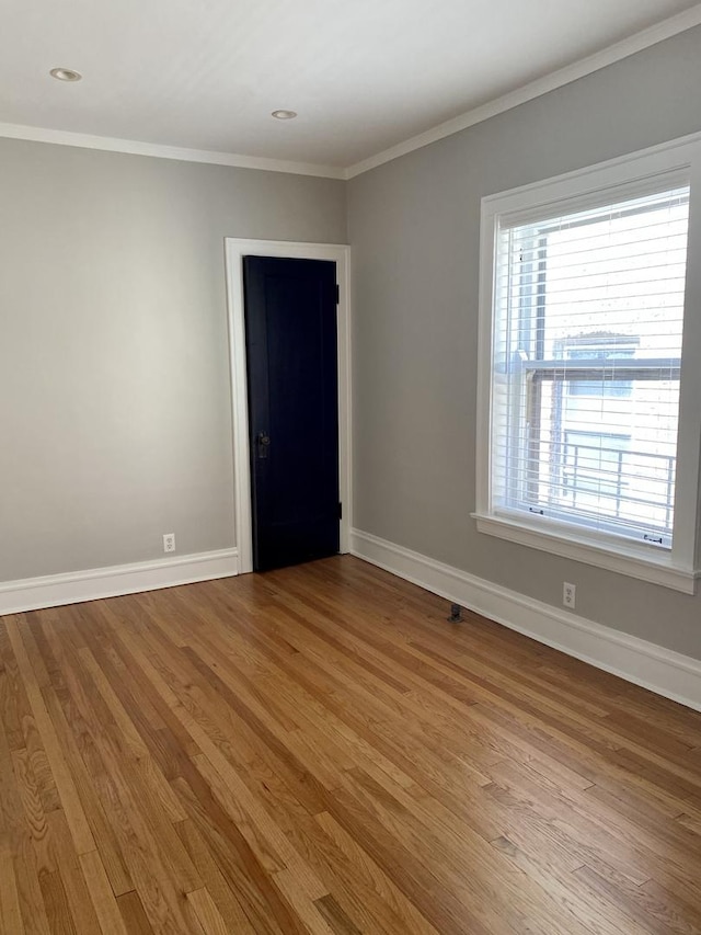 806 Forest Ave Unit 3, Evanston, IL 60202 - empty room with baseboards, light wood-style floors, crown molding, and recessed lighting