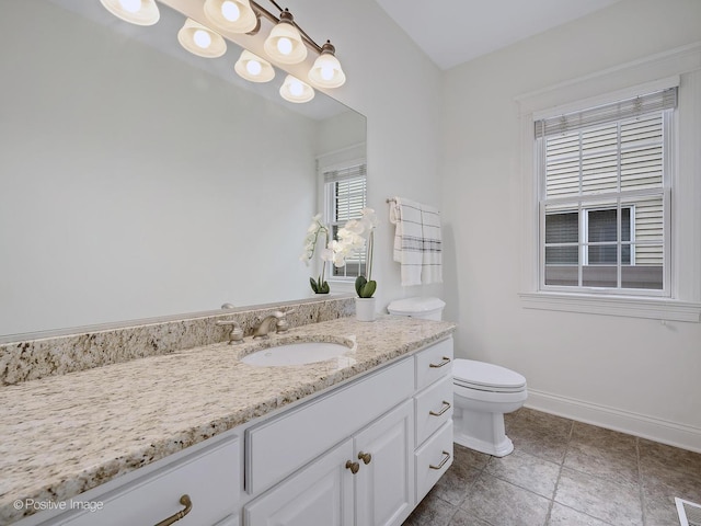 551 W 3rd St, Elmhurst, IL 60126 - bathroom featuring vanity, toilet, baseboards, and tile patterned floors