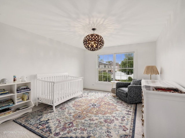 551 W 3rd St, Elmhurst, IL 60126 - bedroom with carpet flooring, a nursery area, and baseboards