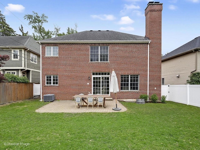 551 W 3rd St, Elmhurst, IL 60126 - rear view of property featuring a patio area, cooling unit, brick siding, a chimney, and a shingled roof
