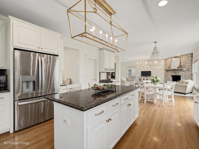 551 W 3rd St, Elmhurst, IL 60126 - kitchen with stainless steel fridge with ice dispenser, open floor plan, light wood-type flooring, white cabinets, and recessed lighting