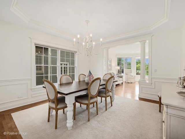 551 W 3rd St, Elmhurst, IL 60126 - dining area with ornate columns, wood finished floors, ornamental molding, a chandelier, and a tray ceiling