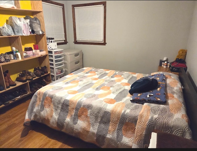 bedroom with wood finished floors