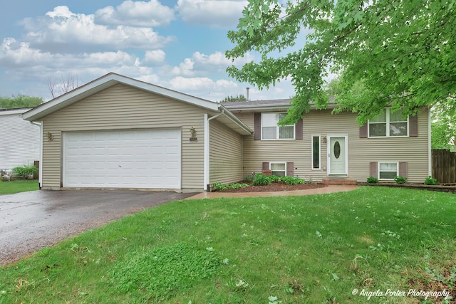 140 Shadowbrook Dr, Capron, IL 61012 - view of front of property featuring asphalt driveway, a front yard, and a garage