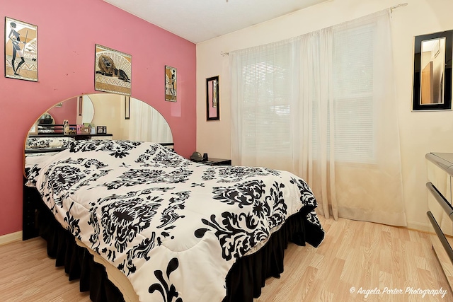 140 Shadowbrook Dr, Capron, IL 61012 - bedroom with light wood-style flooring and baseboards