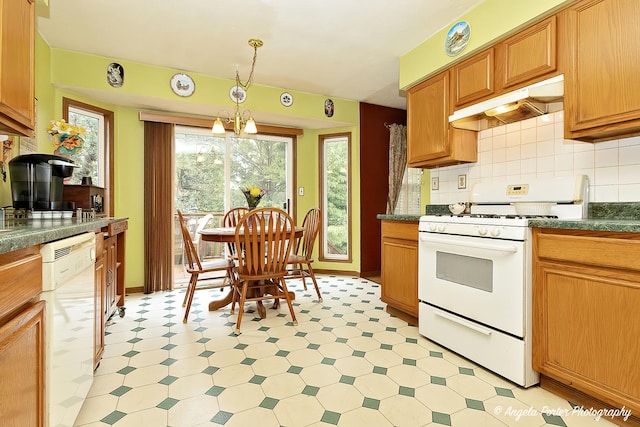 140 Shadowbrook Dr, Capron, IL 61012 - kitchen featuring white appliances, under cabinet range hood, light floors, and dark countertops