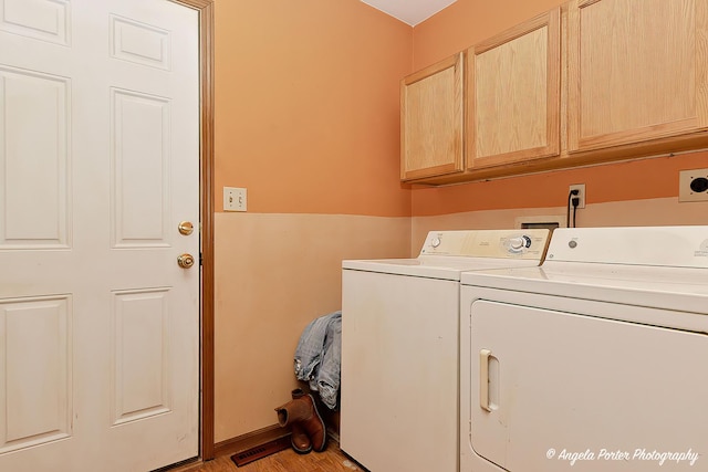 140 Shadowbrook Dr, Capron, IL 61012 - washroom featuring cabinet space, independent washer and dryer, and light wood-style flooring