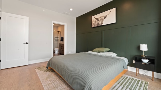3124 S Benson St Unit 6, Chicago, IL 60608 - bedroom featuring wood finished floors, baseboards, ensuite bath, and recessed lighting