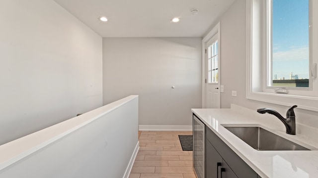 3124 S Benson St Unit 6, Chicago, IL 60608 - bathroom featuring vanity, baseboards, wood tiled floors, recessed lighting, and beverage cooler