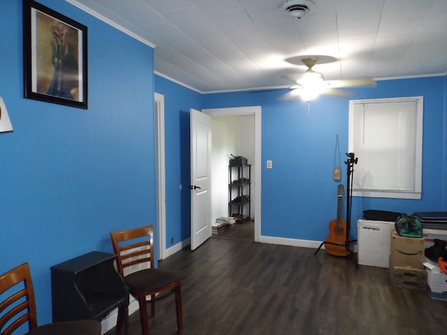office featuring wood finished floors, baseboards, ornamental molding, and a ceiling fan