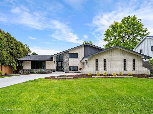 7235 Kiowa Ln, Palos Heights, IL 60463 - view of front of home with brick siding, a chimney, and driveway