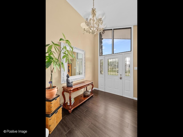 7235 Kiowa Ln, Palos Heights, IL 60463 - foyer entrance featuring a chandelier, high vaulted ceiling, dark wood-style floors, and baseboards