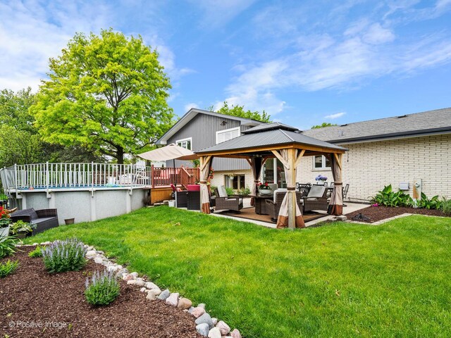 7235 Kiowa Ln, Palos Heights, IL 60463 - back of house with outdoor lounge area, a gazebo, brick siding, a yard, and a deck