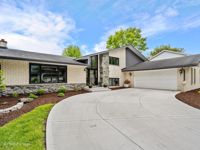 7235 Kiowa Ln, Palos Heights, IL 60463 - view of front of house featuring brick siding, concrete driveway, and a garage