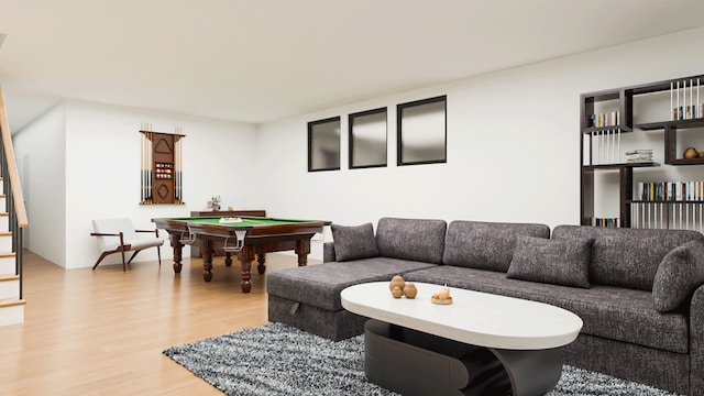 living room featuring wood finished floors, stairway, and pool table