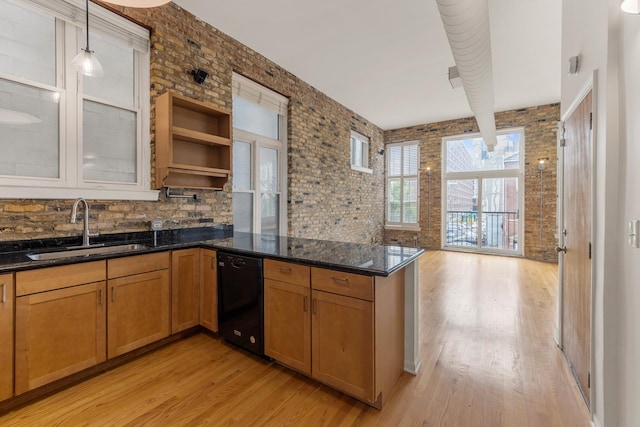 1012 W Diversey Pkwy Unit 2, Chicago, IL 60614 - kitchen featuring dishwasher, a sink, light wood finished floors, a peninsula, and dark stone counters