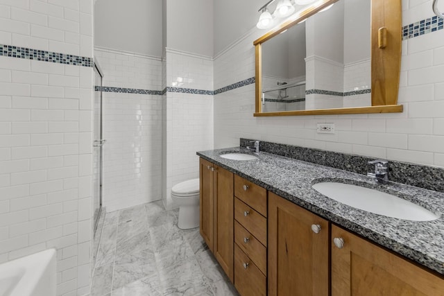 1012 W Diversey Pkwy Unit 2, Chicago, IL 60614 - full bathroom with tile walls, an enclosed shower, double vanity, toilet, and marble look tile flooring